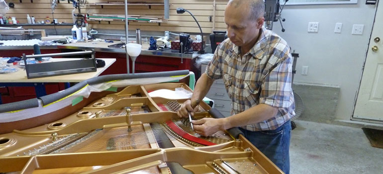Piano soundboard repairs and restringing
